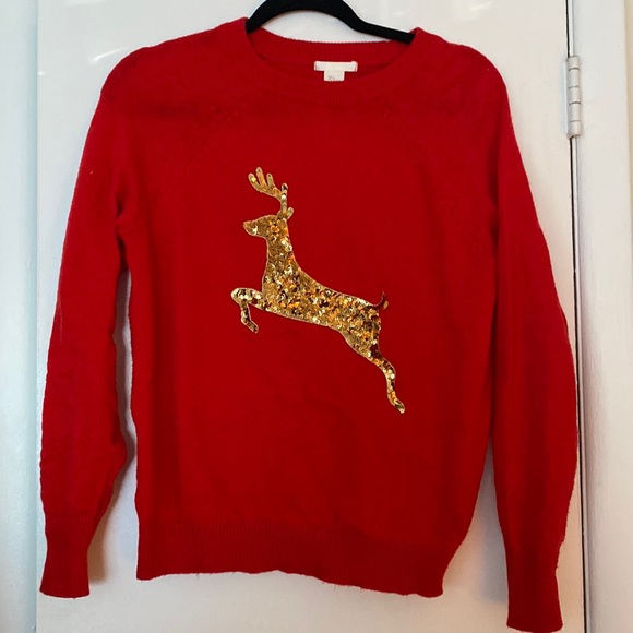 red sweater with gold sequin reindeer